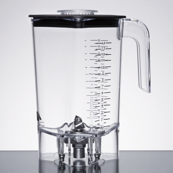 A clear polycarbonate container with a handle for a Hamilton Beach blender.