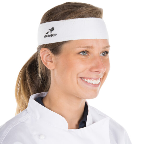 A woman wearing a white Headsweats headband.