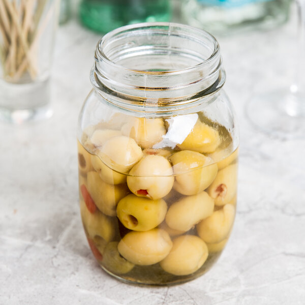 An American Metalcraft condiment mason jar filled with green olives.