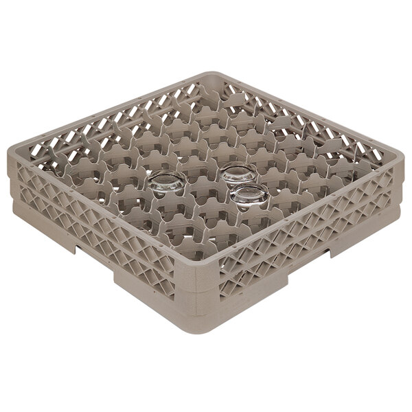 A beige plastic Vollrath glass rack with 42 compartments.
