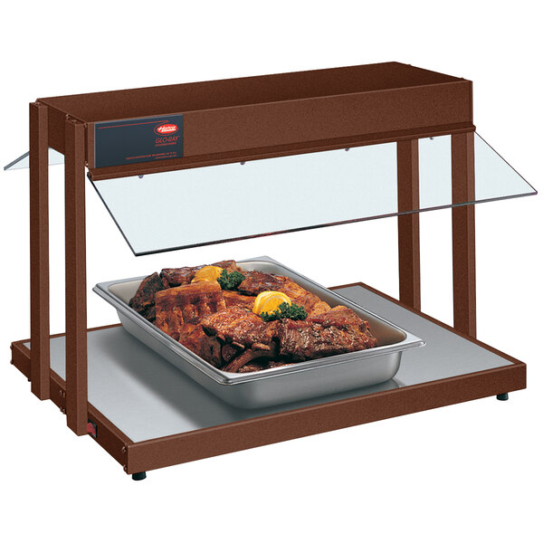 A Hatco countertop buffet warmer with a tray of meat on it.