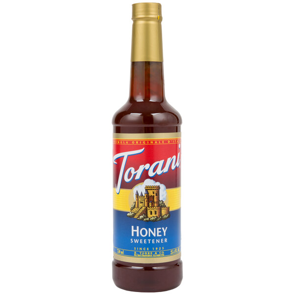 A Torani plastic bottle of honey syrup with a red label.