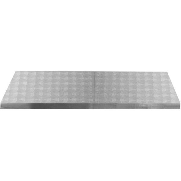 A Tablecraft stainless steel table cover with a swirl pattern on it.