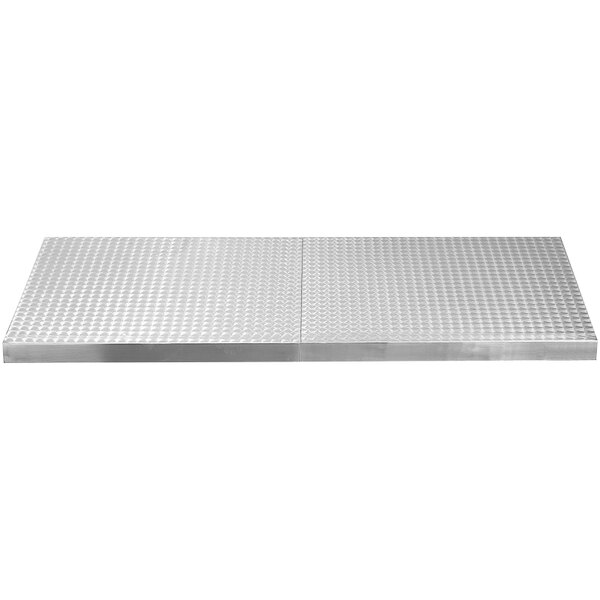 A stainless steel Tablecraft cover with a circle swirl pattern.