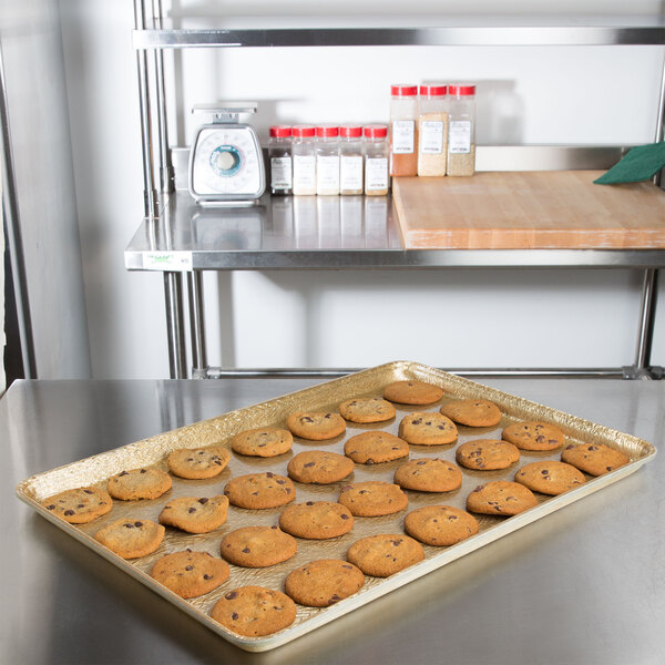 A MFG Tray Bakery Display Tray with cookies on a table.