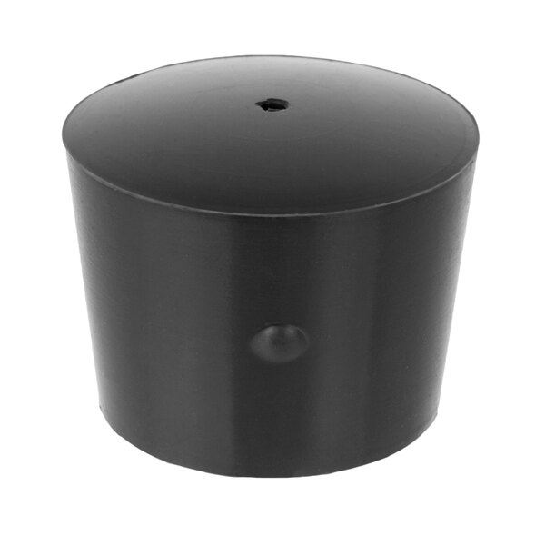 A black plastic cylinder with a hole in the top.