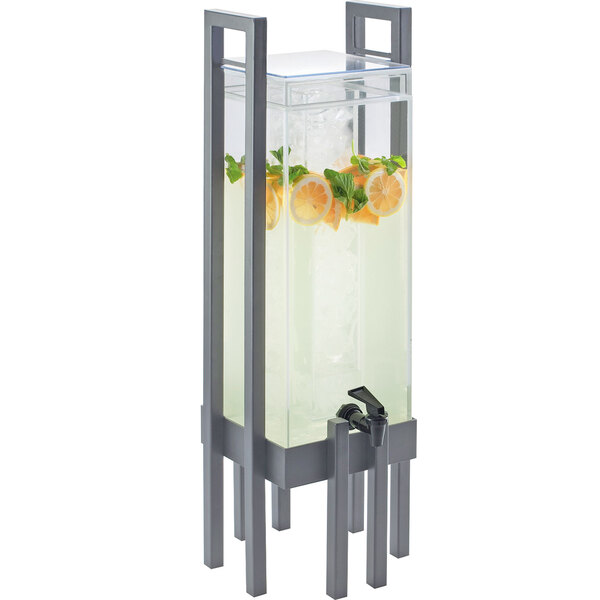 A Cal-Mil acrylic beverage dispenser with silver accents and an ice chamber.