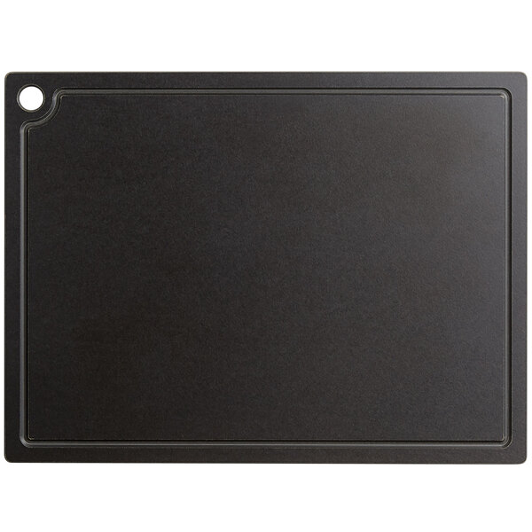 A black rectangular Cal-Mil grooved cutting board with a white border.