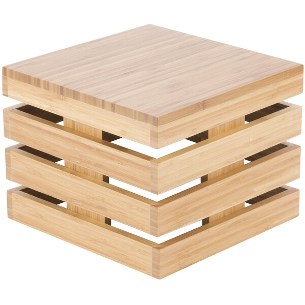 A Cal-Mil bamboo square crate riser with four stacked wooden slats.