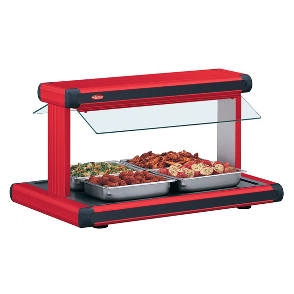 A red Hatco countertop buffet warmer with black insets over food trays.