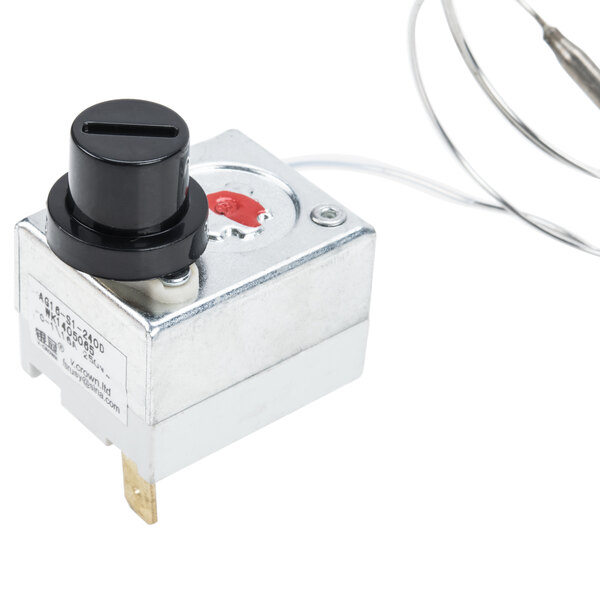 An Avantco temperature limiter, a small black and white metal box with a red button and black knob.