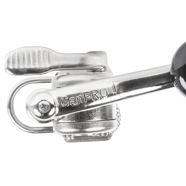A silver metal clip with a black button on the side of a Nemco CanPRO can opener.
