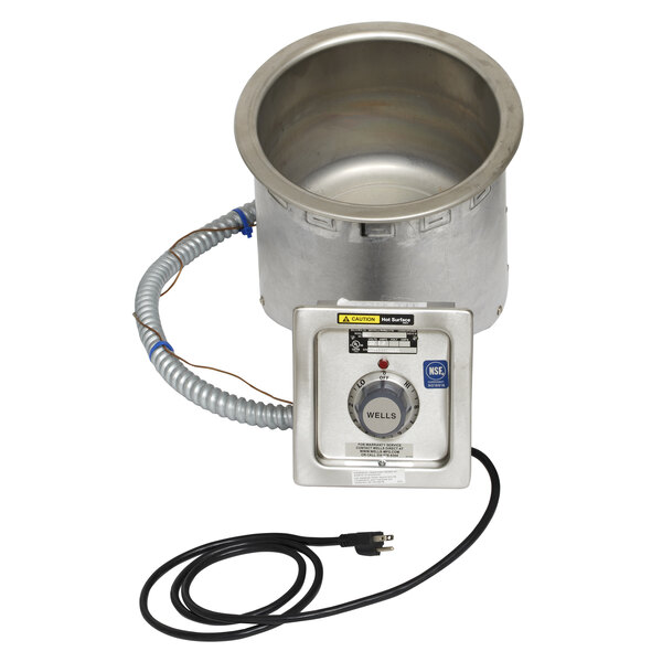 A Wells round metal soup well with a power cord and drain hose.