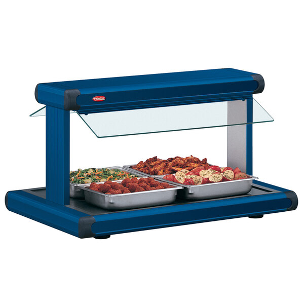 A blue buffet food warmer with food in it.