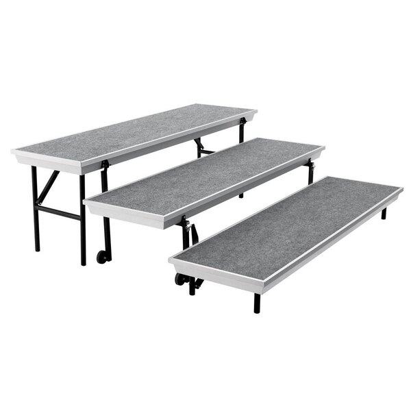 A National Public Seating gray carpeted choral riser with black metal legs.