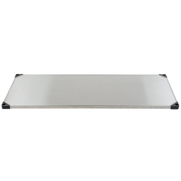 A rectangular stainless steel surface with black corners.