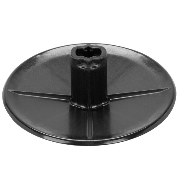 A black plastic Waring continuous feed slinger with a hole in the middle.