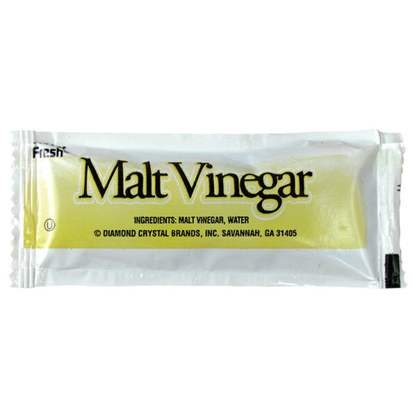 A close-up of a white and yellow malt vinegar packet with black text.