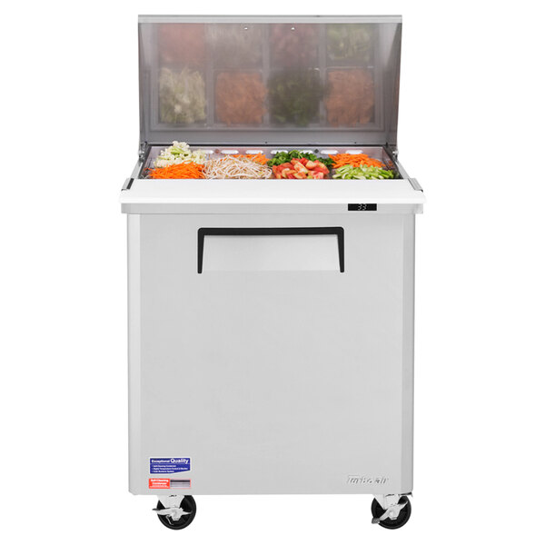 A Turbo Air stainless steel sandwich prep table with a large refrigerated compartment.