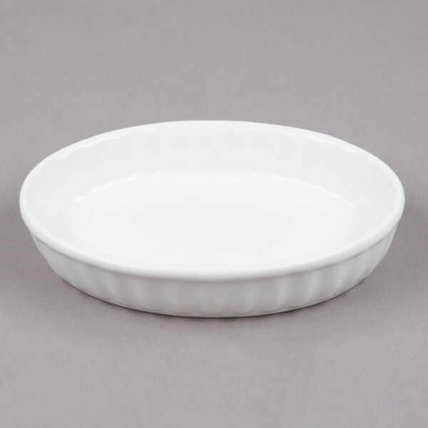 Tuxton BWK0602 6 oz. White Oval Fluted China Souffle / Creme Brulee