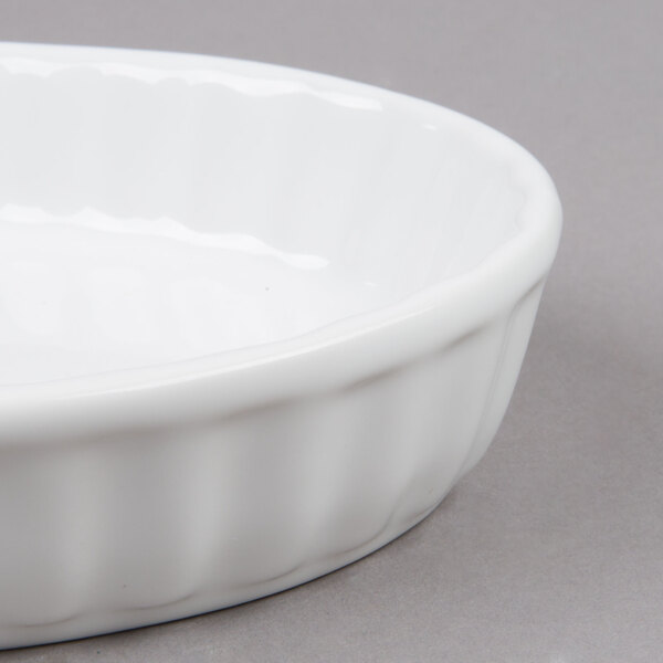 Tuxton BWK0602 6 oz. White Oval Fluted China Souffle / Creme Brulee