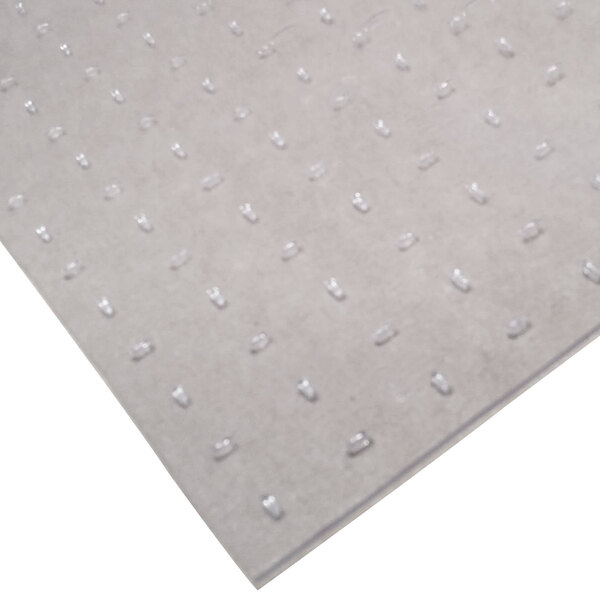 A clear vinyl floor protection mat with a textured surface.