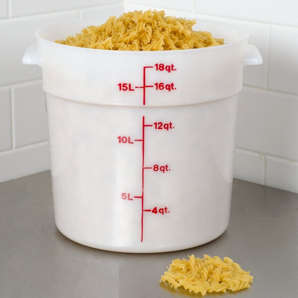 A white Cambro food storage container filled with noodles.