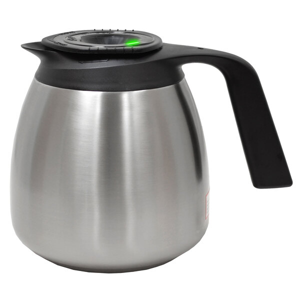 A silver stainless steel Curtis coffee decanter with a black lid.