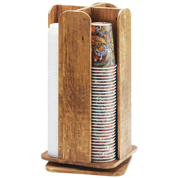 A wooden Cal-Mil Madera cup and lid organizer with a stack of paper cups.