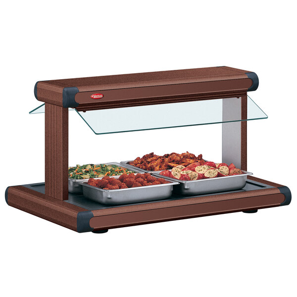 A Hatco buffet food warmer on a table with food in it.
