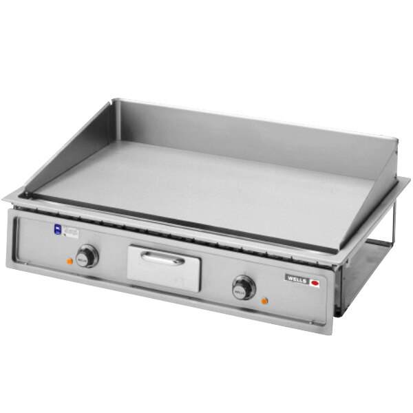 A Wells countertop electric griddle with stainless steel plates.