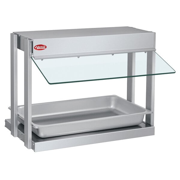 A Hatco stainless steel food warmer with a glass shelf.