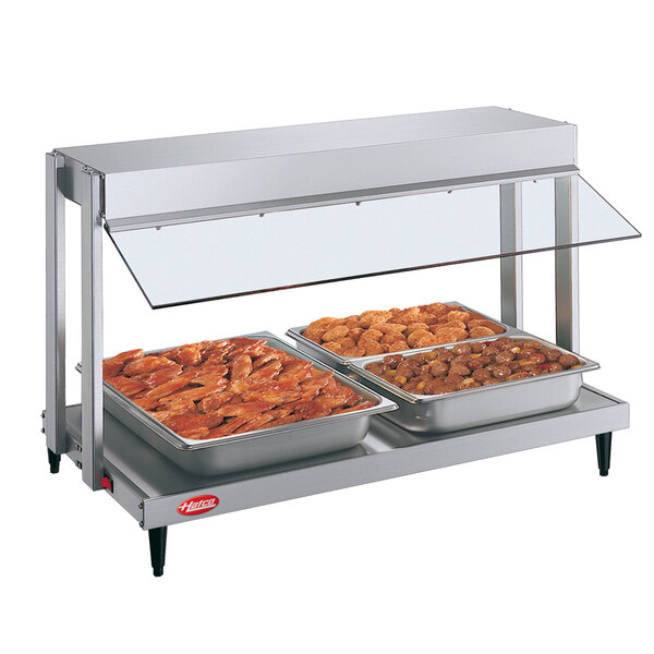 A Hatco countertop food warmer with two trays of meat.