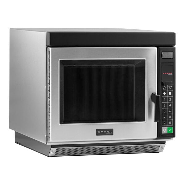 A silver Amana commercial microwave oven with a black door.