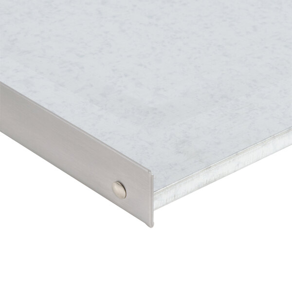 A close-up of a metal crumb tray.