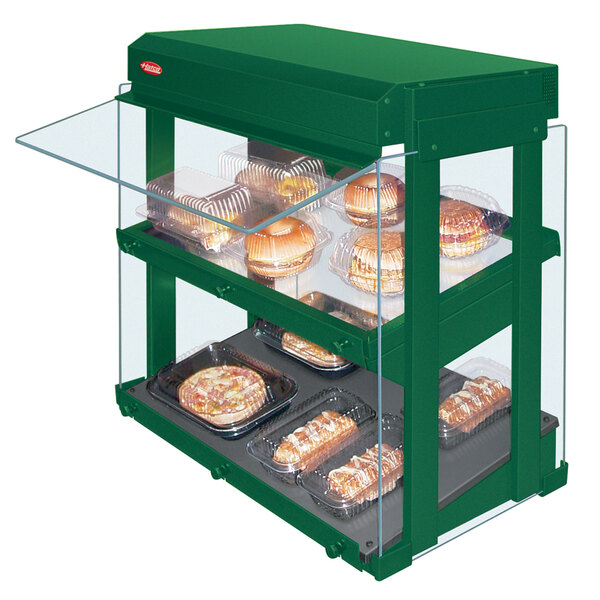 A Hunter green Hatco countertop food display warmer with food on it.