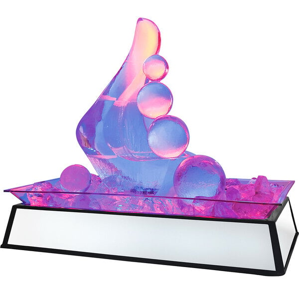 A Cal-Mil ice sculpture pedestal with a glass sculpture of pink and blue lights.