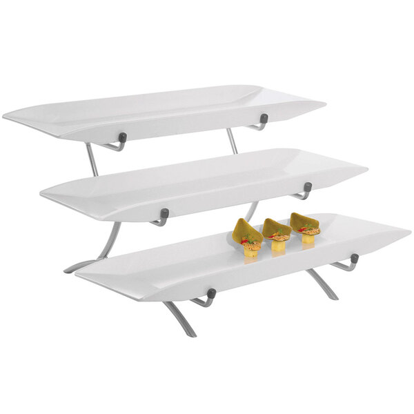 A Cal-Mil platinum metal three tier stand with white melamine platters holding food.