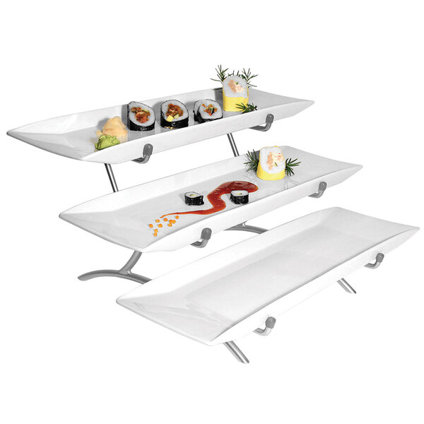 A Cal-Mil white rectangular wire stand with three white porcelain platters of sushi.
