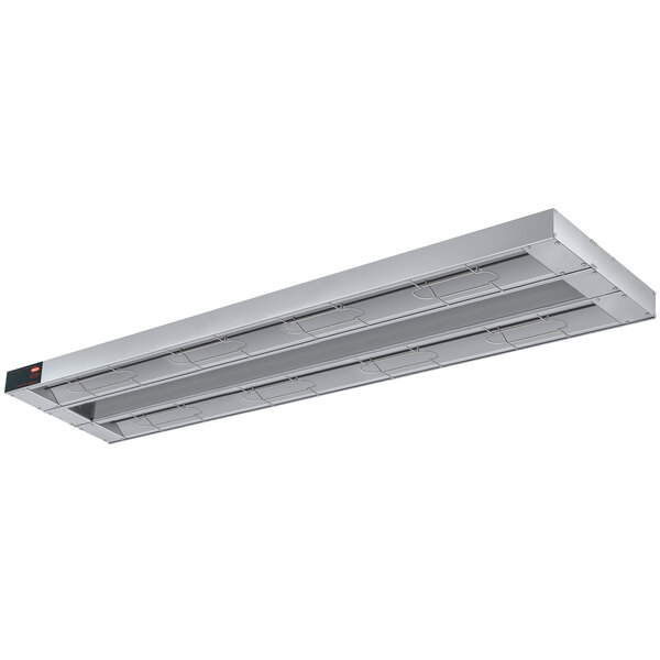 A long rectangular Hatco Glo-Ray infrared warmer with a light on a stainless steel shelf.