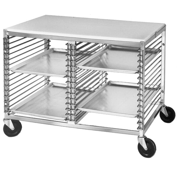 A silver metal Channel mobile work table with black wheels.