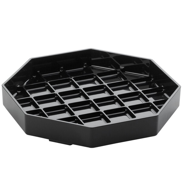 A black plastic Cal-Mil octagonal drip tray with many small holes.