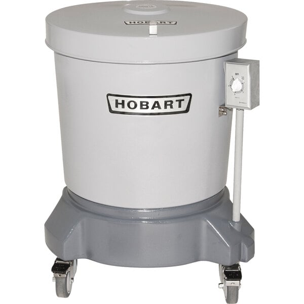 A white and grey Hobart polyethylene salad dryer with a dial.