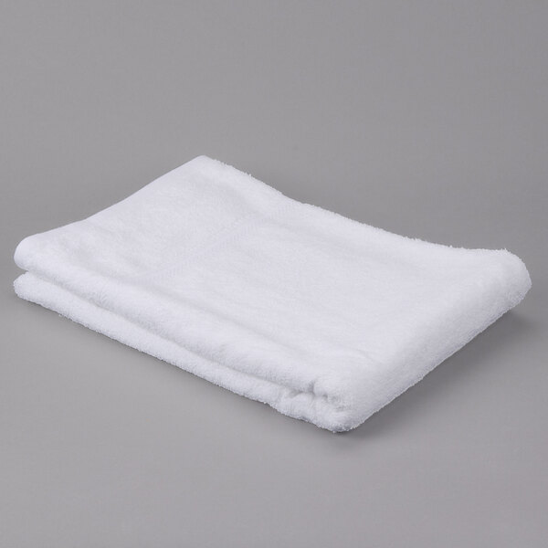 A folded white Oxford Gold Dobby pool towel.
