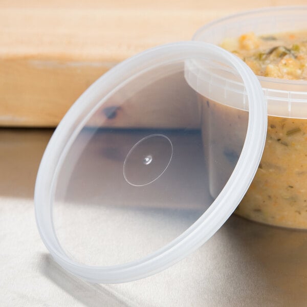 A plastic Tamper Resistant Tamper Evident Safe Lock deli container lid with a circle in the middle.