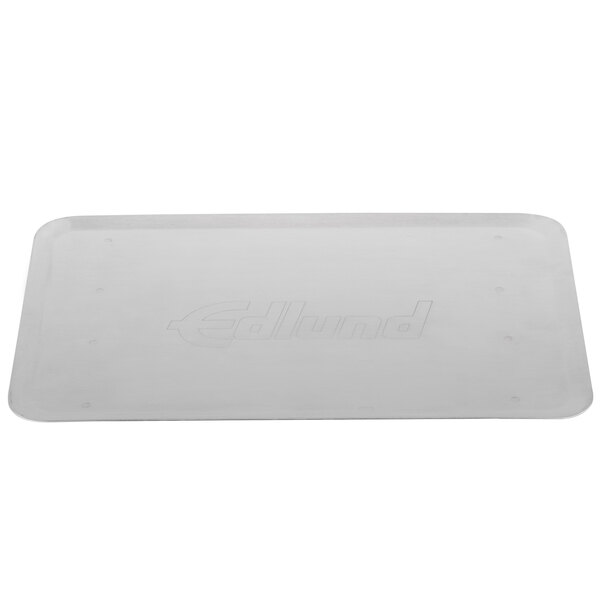 A white rectangular tray with the word "Edlund" on it.