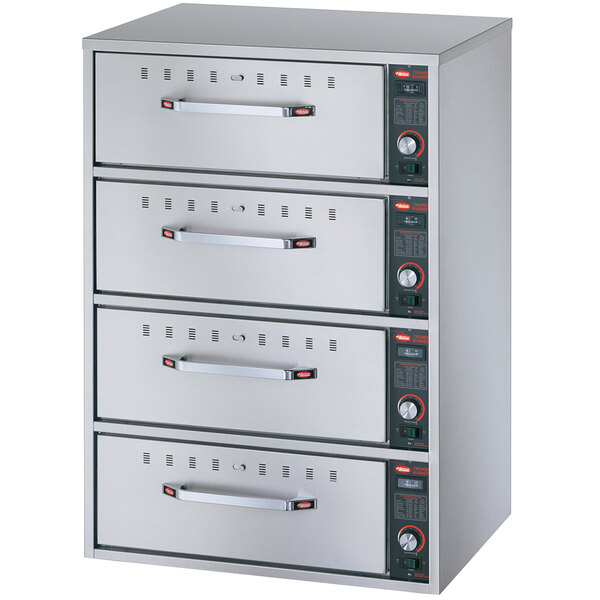 A Hatco stainless steel freestanding four drawer warmer.