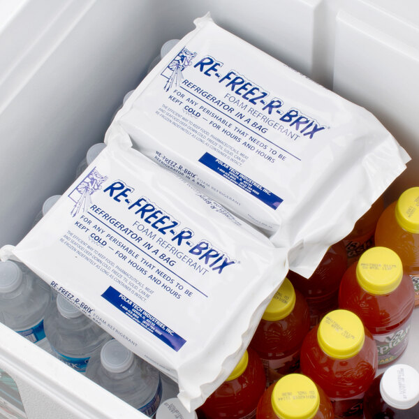 A white Polar Tech foam freeze pack in a white cooler filled with bottles of water.