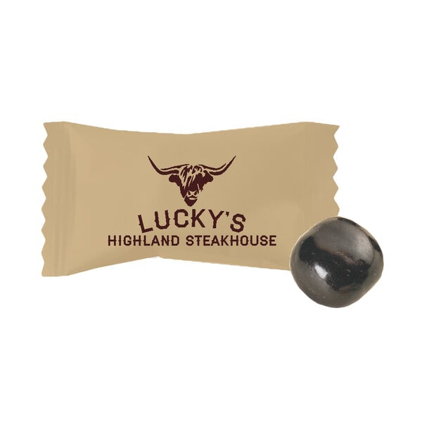 A brown packet of customizable chocolate buttermints with a black round object.