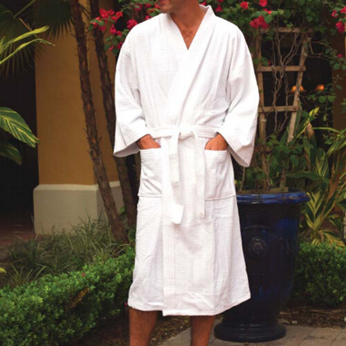 A man wearing a white Oxford Waffle Weave bath robe.